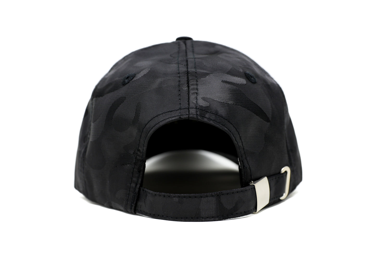 
                  
                    EMF PROTECTION  - Photo of Blushield black camo low radiation cap, back view
                  
                