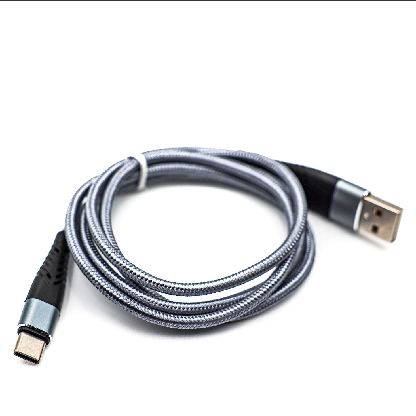 
                  
                    A gray USB-C smart chip charger photographed on a brilliant white background
                  
                