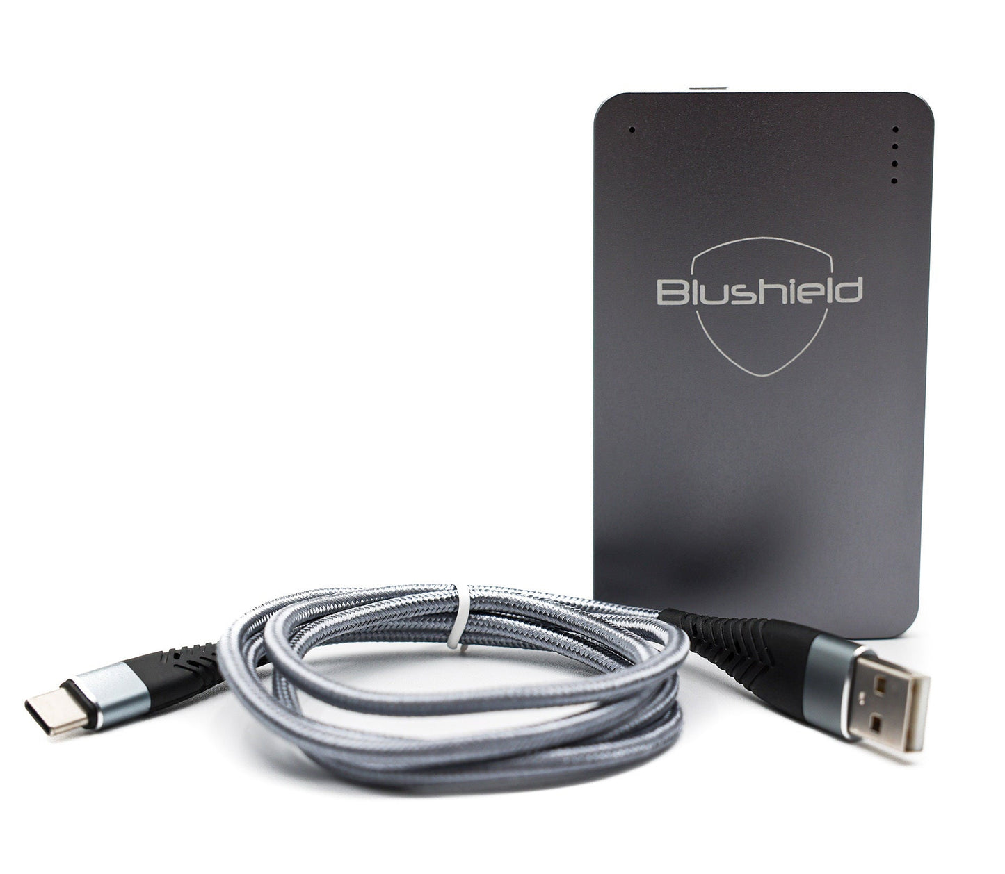 A gray USB-C smart chip charger coiled next to a Blushield Ultimate portable