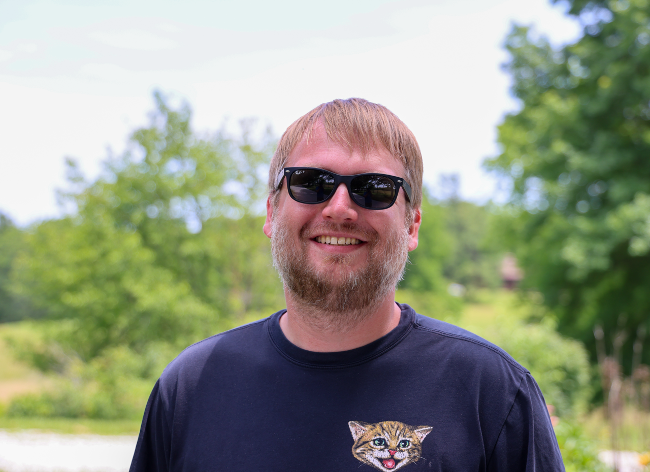EMF PROTECTION  - picture of employee Brandon Humble in cat t-shirt