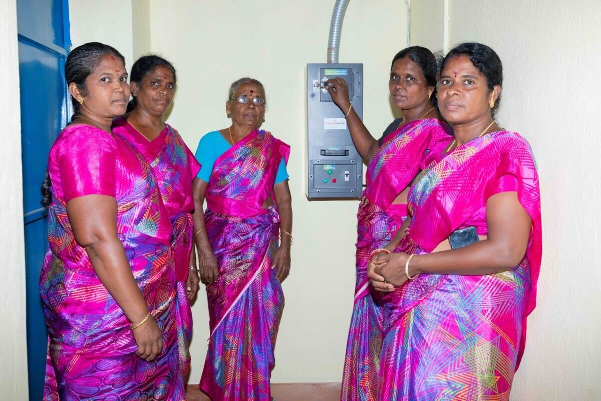 Locals pose for a picture in the recently finished girls safe space in India
