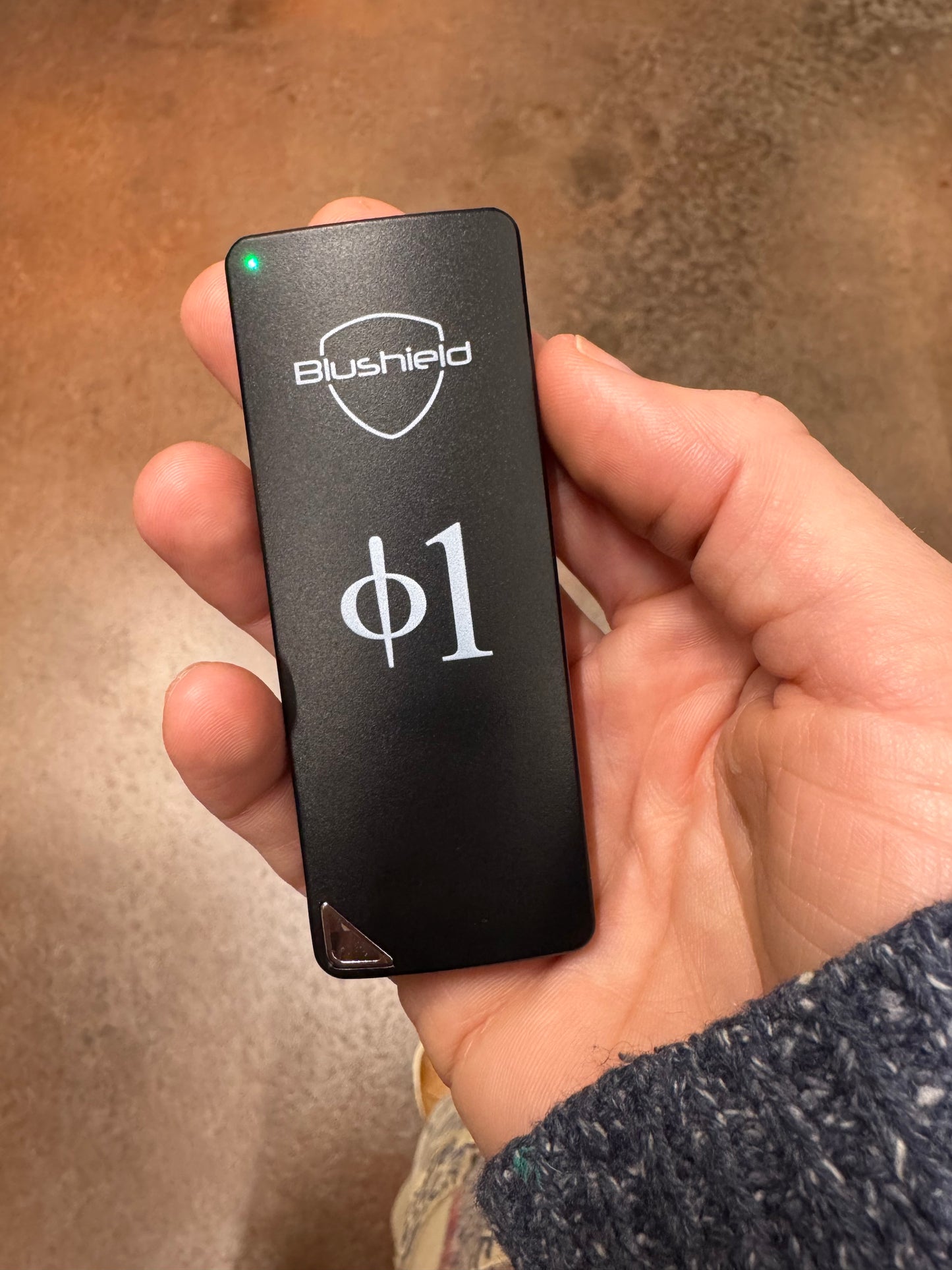 
                  
                    A person holds their Phi 1 portable in their hand in this picture
                  
                