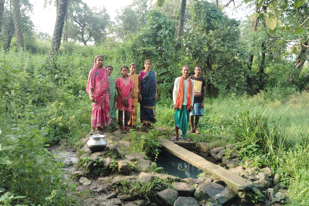 A water well in India surrounded by locals