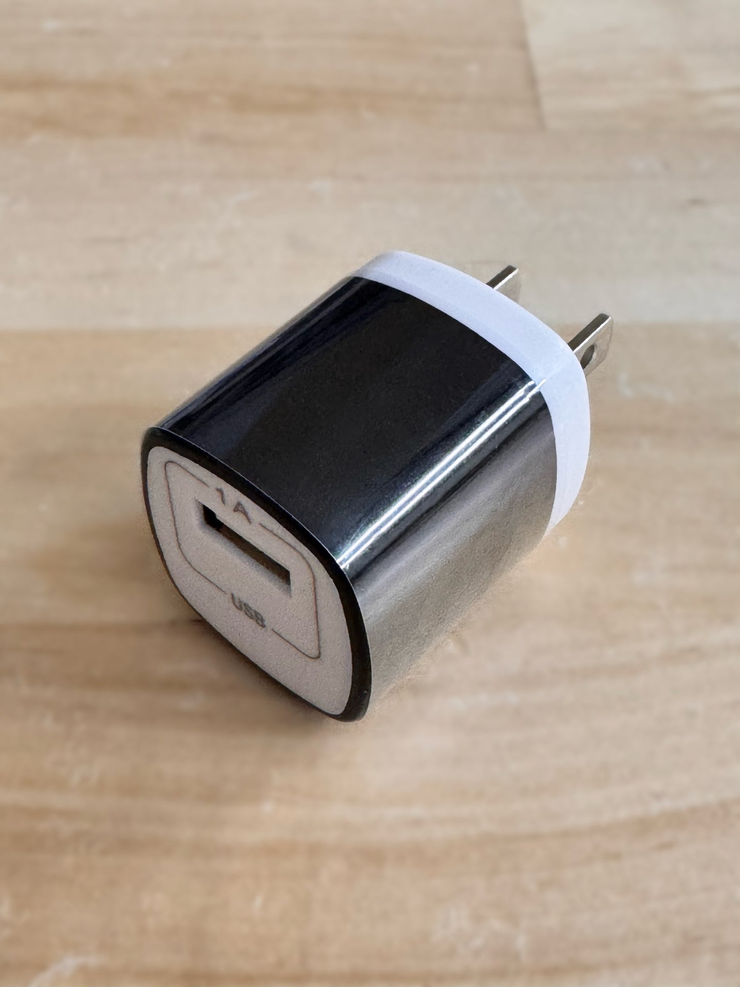 
                  
                    EMF PROTECTION  - black wall charger on wood table
                  
                