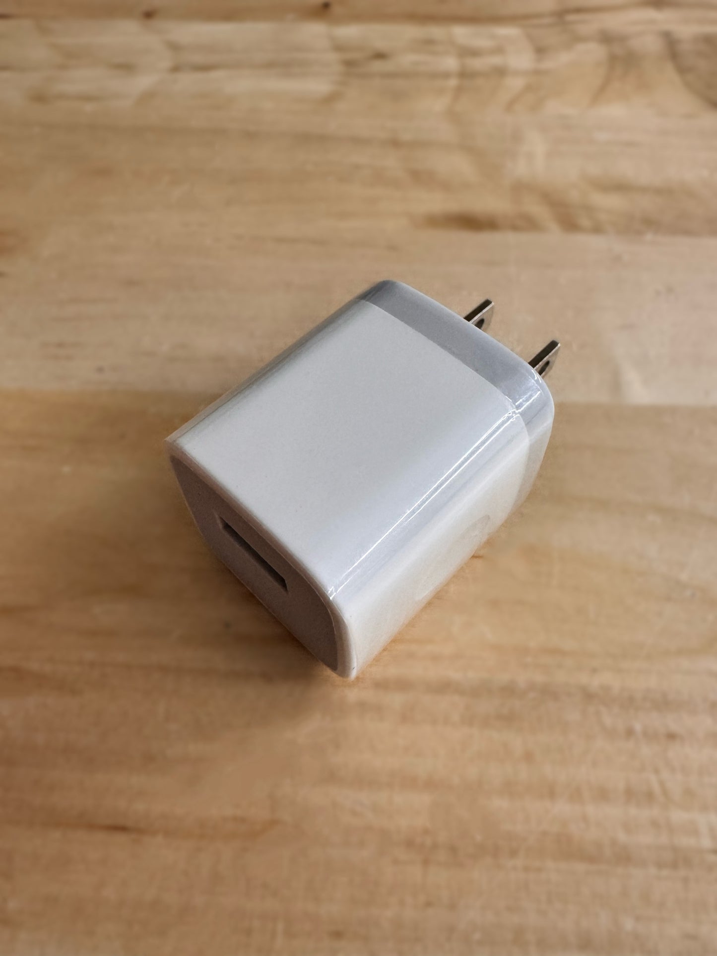 
                  
                    EMF PROTECTION  - white wall charger on wood table
                  
                